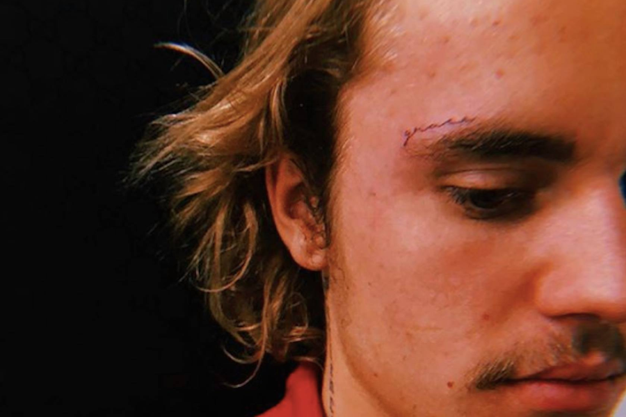 justin face tattoo