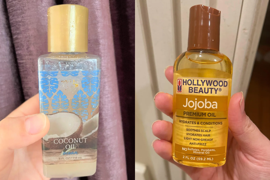 Side-by-side view of two hands holding different hair oils: one holding a 4 oz bottle of coconut oil with a gold cap and tropical design, and the other holding a 2 oz bottle of Hollywood Beauty Jojoba Premium Oil labeled for hydrating, conditioning, and anti-frizz benefits.