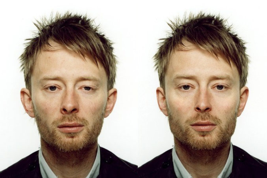 Side-by-side close-up portraits of a man with short, messy hair and a trimmed beard. The left image shows his natural face with one eye appearing more closed, while the right image presents a digitally adjusted version with symmetrical eyes and smoother skin.